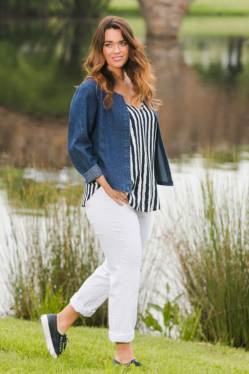 Model Laura wearing size 14 of The Collarless Denim Panel Jacket in colour Denimblue (Blue), from the front, showing the whole outfit