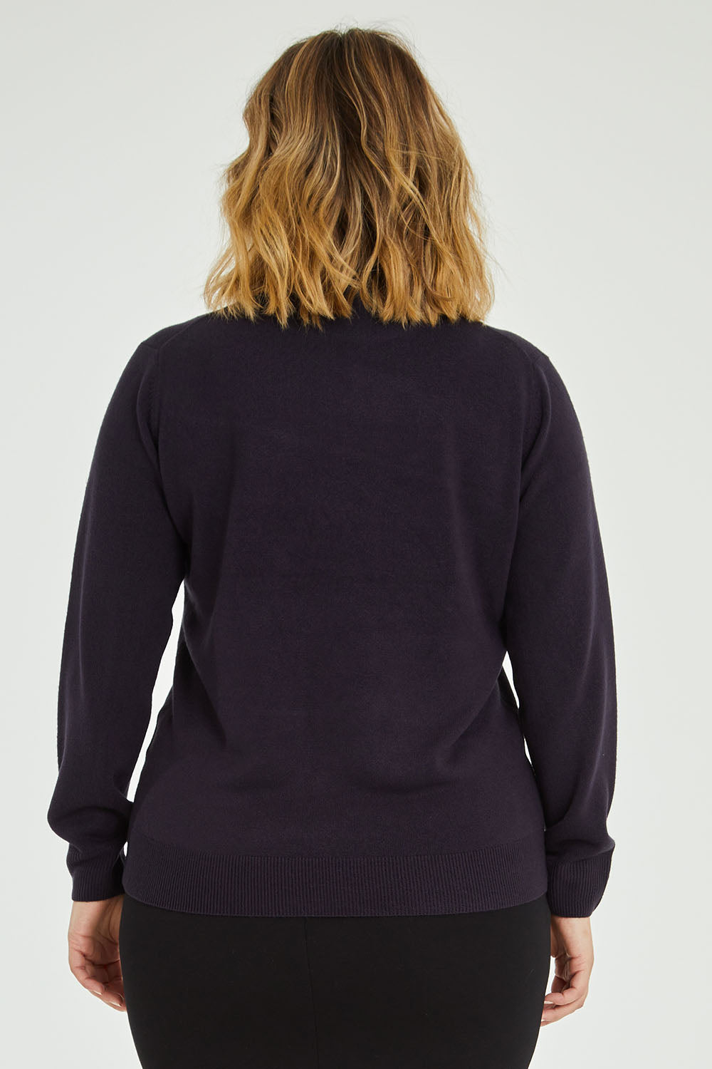 Model Jess wearing size L of The Essential Soft Jumper in colour Navy (Blue), from the back