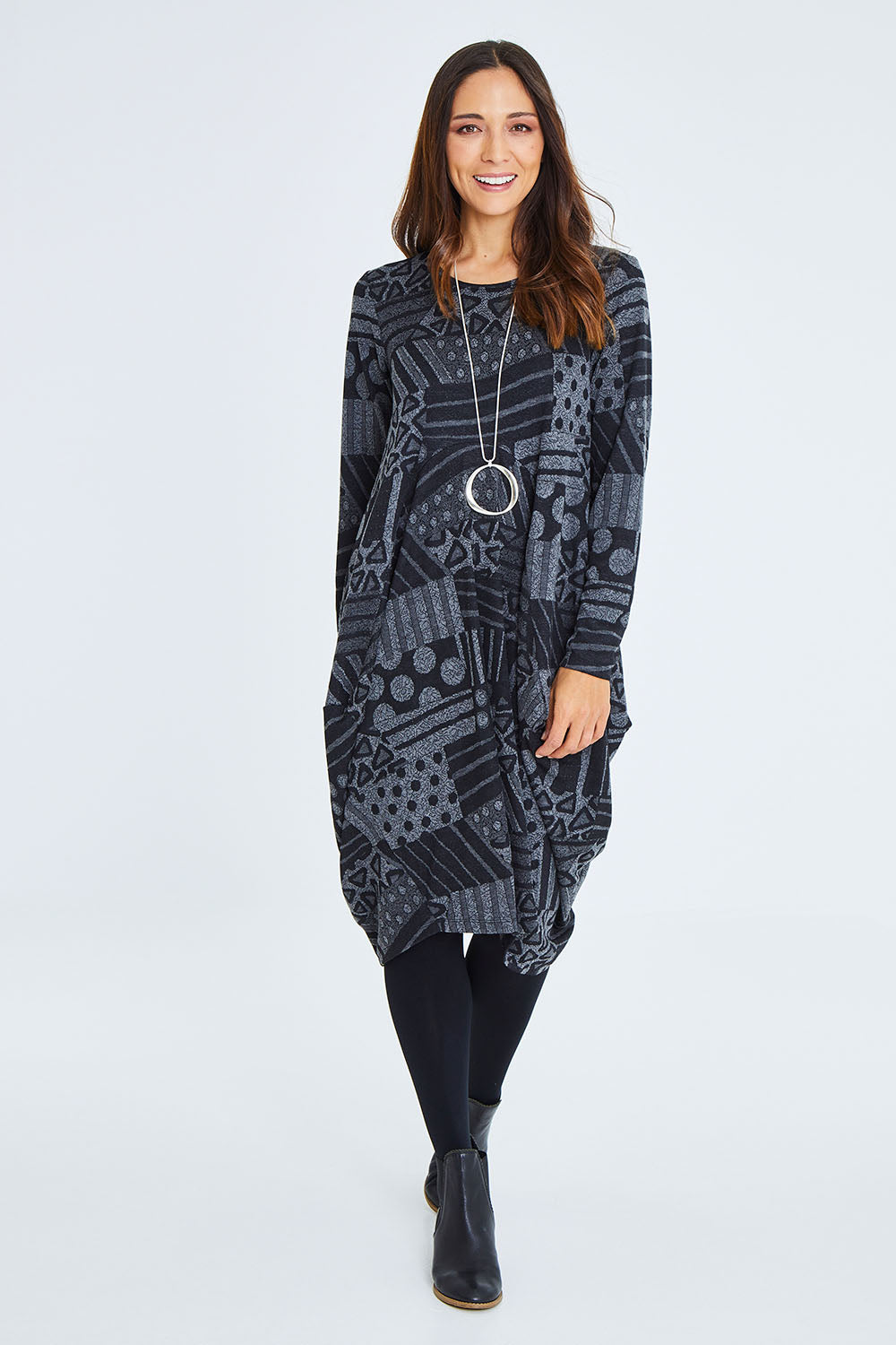 Model Cara wearing size 10 of The Jacquard Bounce Dress in colour Charcoal (Grey), from the front, showing the whole outfit