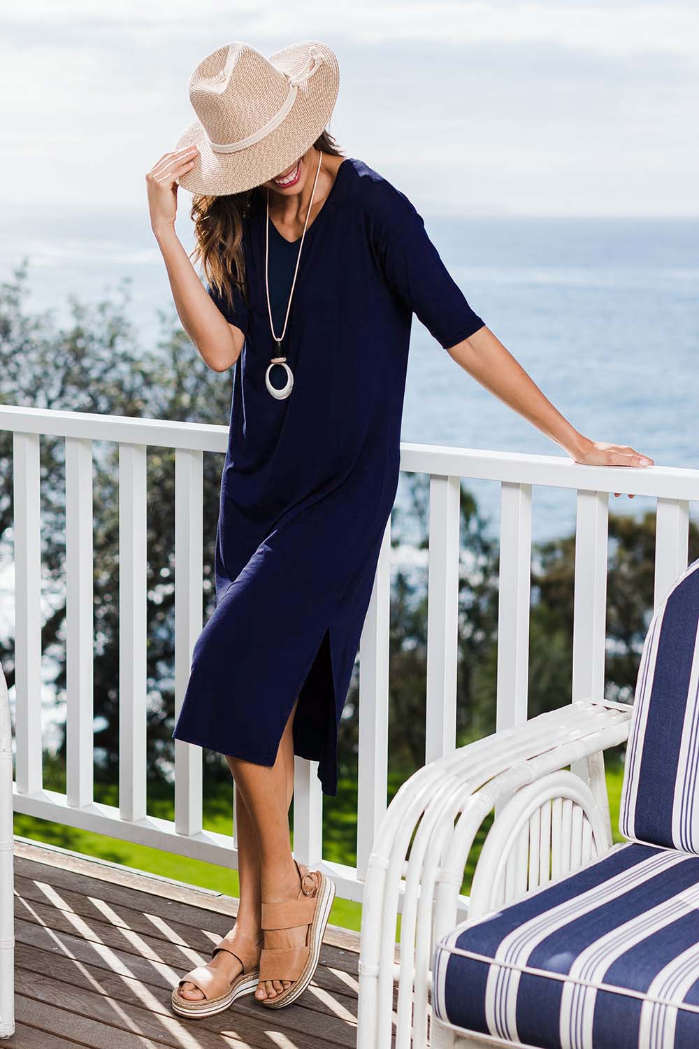 Model Amanda wearing size 10 of The 3/4 Sleeve Mid Length Tee Dress in colour Navy (Blue), from the front, showing the whole outfit