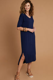 Model Emma wearing size 10 of The 3/4 Sleeve Mid Length Tee Dress in colour Navy (Blue), from the front, showing the whole outfit