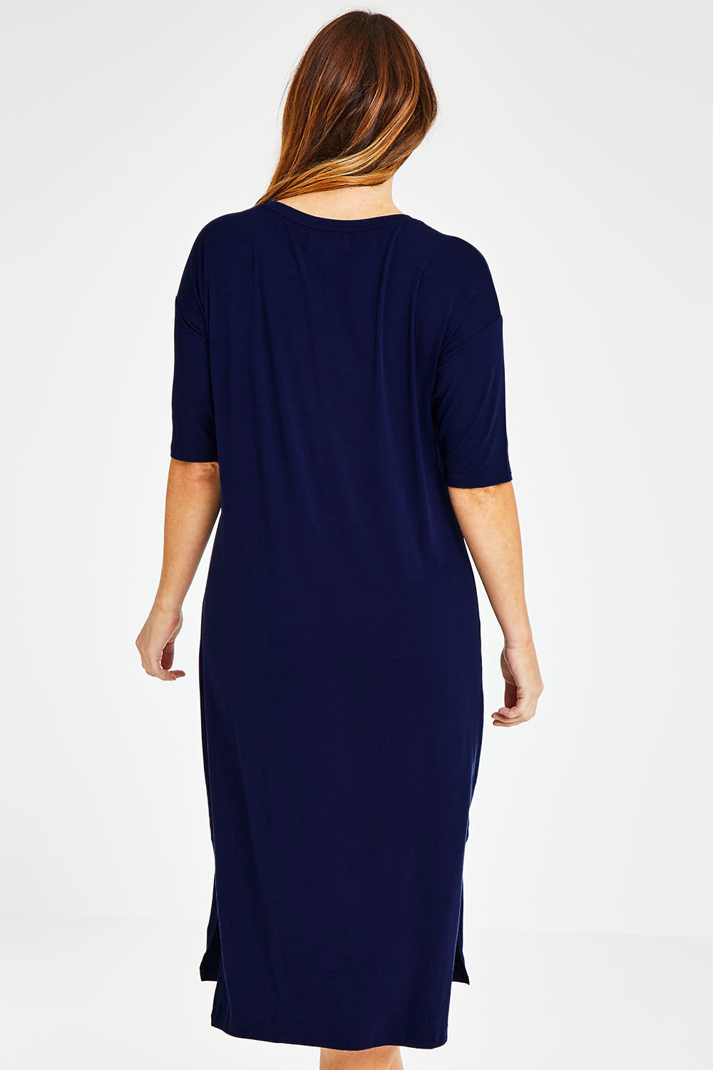 Model Laura wearing size 14 of The 3/4 Sleeve Mid Length Tee Dress in colour Navy (Blue), from the back