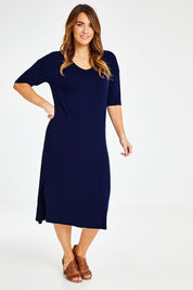 Model Laura wearing size 14 of The 3/4 Sleeve Mid Length Tee Dress in colour Navy (Blue), from the front, showing the whole outfit
