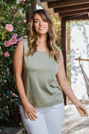 Model Laura wearing size 14 of The Essential Crew Neck Tank in colour Olive (Green), from the front, showing the whole outfit