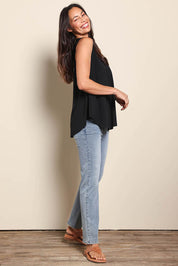 Model Amandam wearing size 10 of the The Essential Swing Tank – Black in colour Black, from the front