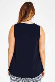 Model Laura wearing size 14 of The Essential Swing Tank in colour Navy (Blue), from the back