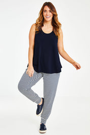 Model Laura wearing size 14 of The Essential Swing Tank in colour Navy (Blue), from the front, showing the whole outfit
