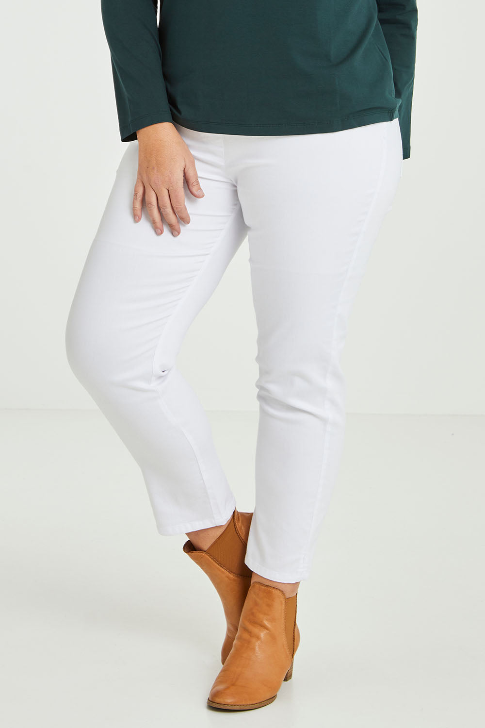 Model Fiona wearing size 16 of The 7/8 Pull On Pant in colour White (White), from the front, cropped image