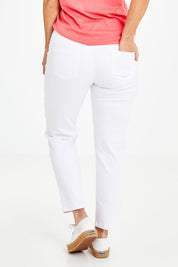 Model Laura wearing size 14 of The 7/8 Pull On Pant in colour White (White), from the front, cropped image