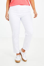 Model Laura wearing size 14 of The 7/8 Pull On Pant in colour White (White), from the front, cropped image