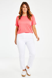 Model Laura wearing size 14 of The 7/8 Pull On Pant in colour White (White), from the front, showing the whole outfit