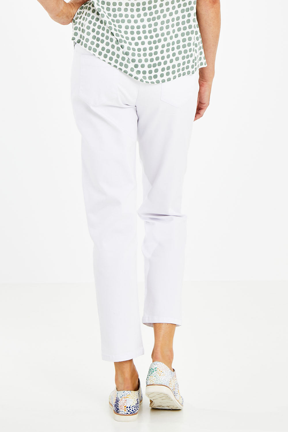 Model Naomi wearing size 10 of The 7/8 Pull On Pant in colour White (White), from the back