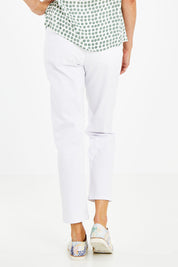 Model Naomi wearing size 10 of The 7/8 Pull On Pant in colour White (White), from the back