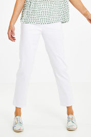 Model Naomi wearing size 10 of The 7/8 Pull On Pant in colour White (White), from the front, cropped image