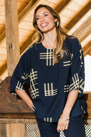 Model Amanda wearing size 10 of The Relax Fit Printed Top in colour Navycamel (Blue), from the front, showing the whole outfit