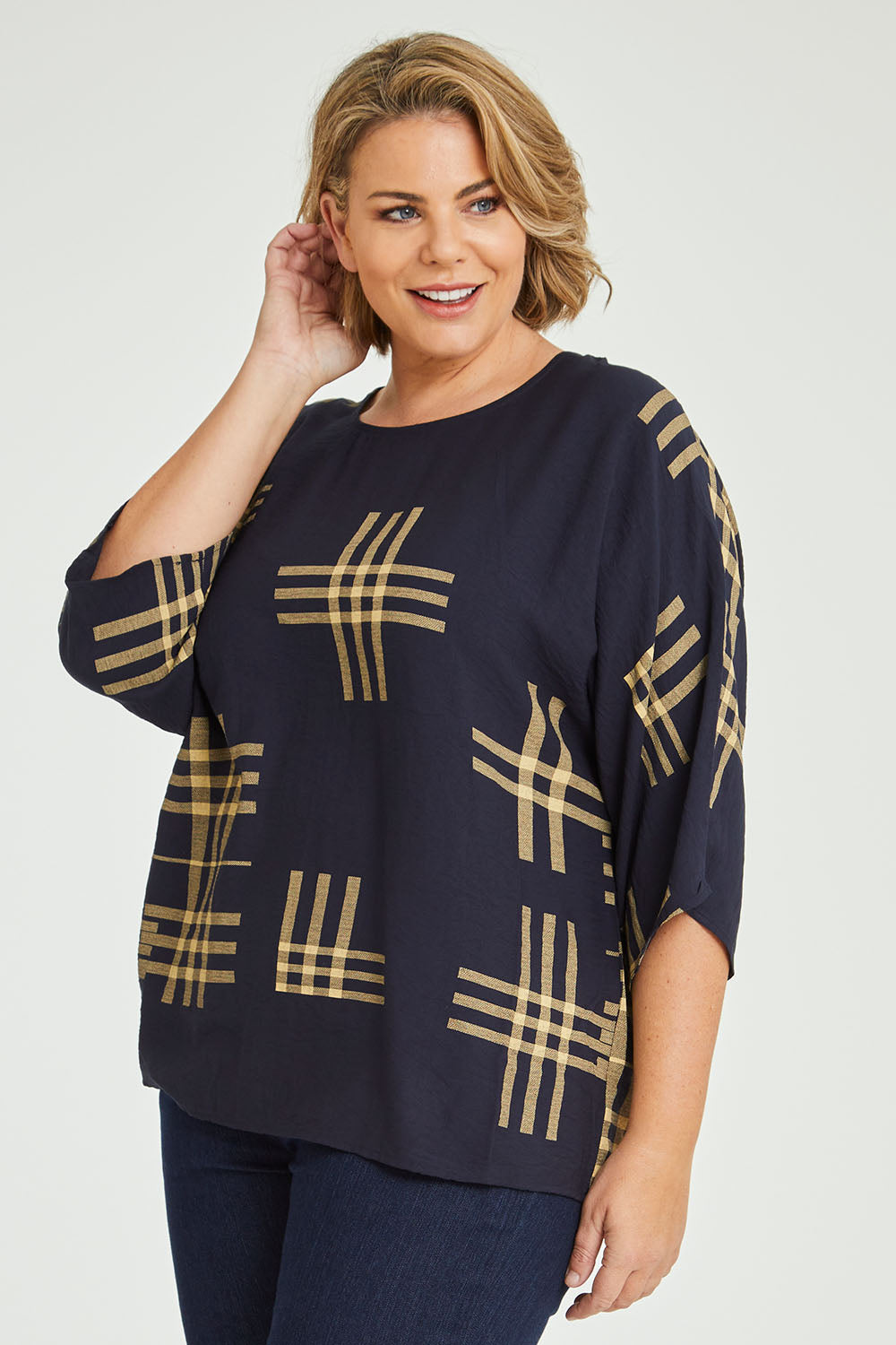 Model Fiona wearing size 16 of The Relax Fit Printed Top in colour Navycamel (Blue), from the front, cropped image