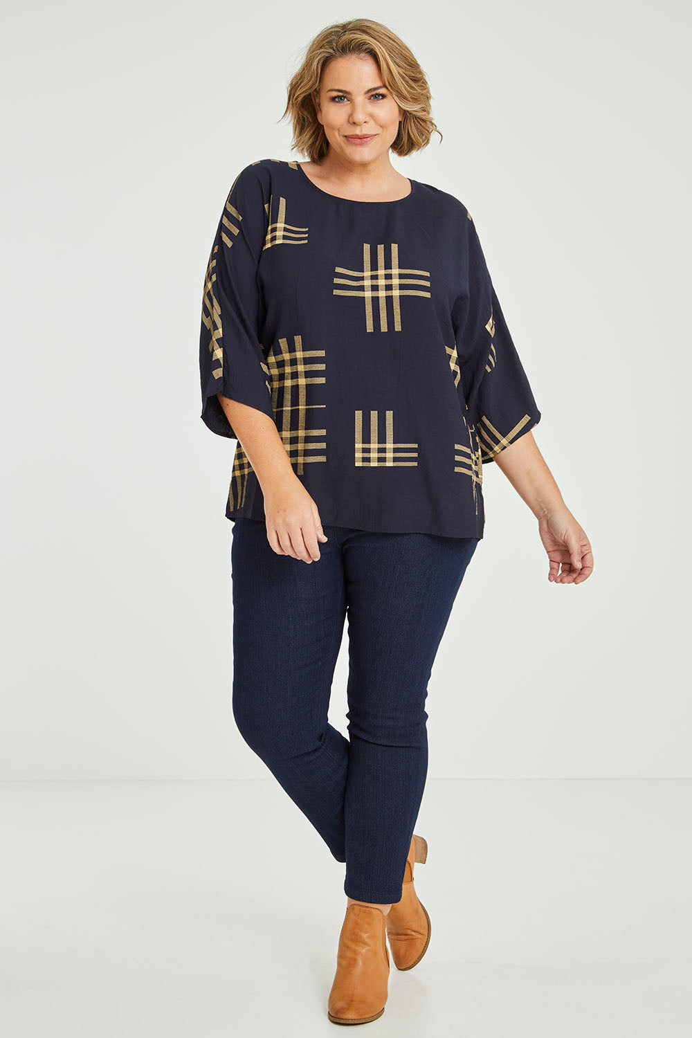 Model Fiona wearing size 16 of The Relax Fit Printed Top in colour Navycamel (Blue), from the front, showing the whole outfit