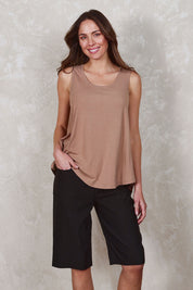 Model Madeline wearing size 10 of The Cargo Short in colour Black (Black), from the front, showing the whole outfit