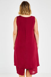 Model Jess wearing size 14 of The Everyday Layered Dress in colour Cherryred (Red), from the back