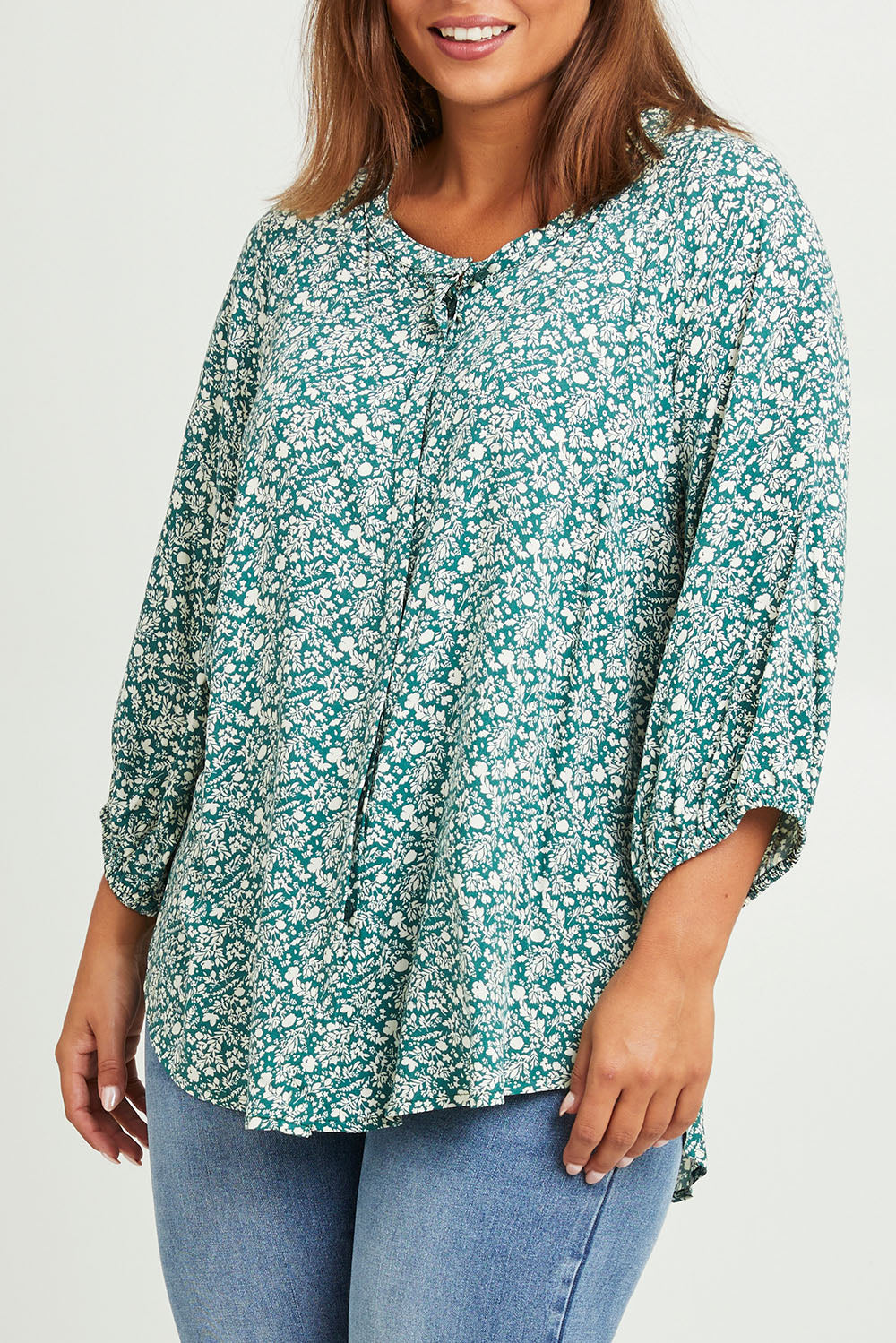 Model Monique wearing size 14 of The Perfect Relaxed Fit Shirt in colour Greenivory (Green), from the front, cropped image
