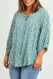 Model Monique wearing size 14 of The Perfect Relaxed Fit Shirt in colour Greenivory (Green), from the front, cropped image