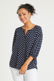 Model Noli wearing size 14 of The Perfect Relaxed Fit Shirt in colour Navyspot (Blue), from the front, cropped image