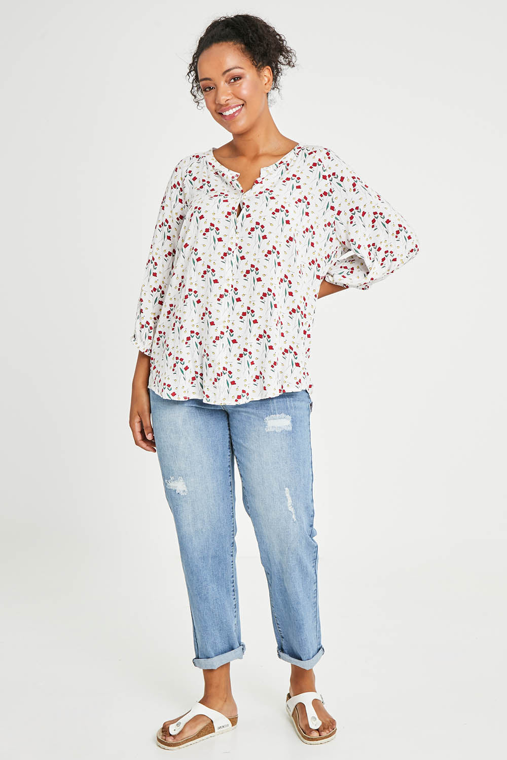 Model Noli wearing size 14 of The Perfect Relaxed Fit Shirt in colour Redfloral (White), from the front, showing the whole outfit