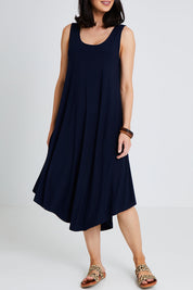 Model Andrea wearing size 10 of The Recycled High Low Dress in colour Navy (Blue), from the front, cropped image