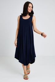 Model Andrea wearing size 10 of The Recycled High Low Dress in colour Navy (Blue), from the front, showing the whole outfit