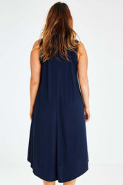 Model Laura wearing size 14 of The Recycled High Low Dress in colour Navy (Blue), from the back