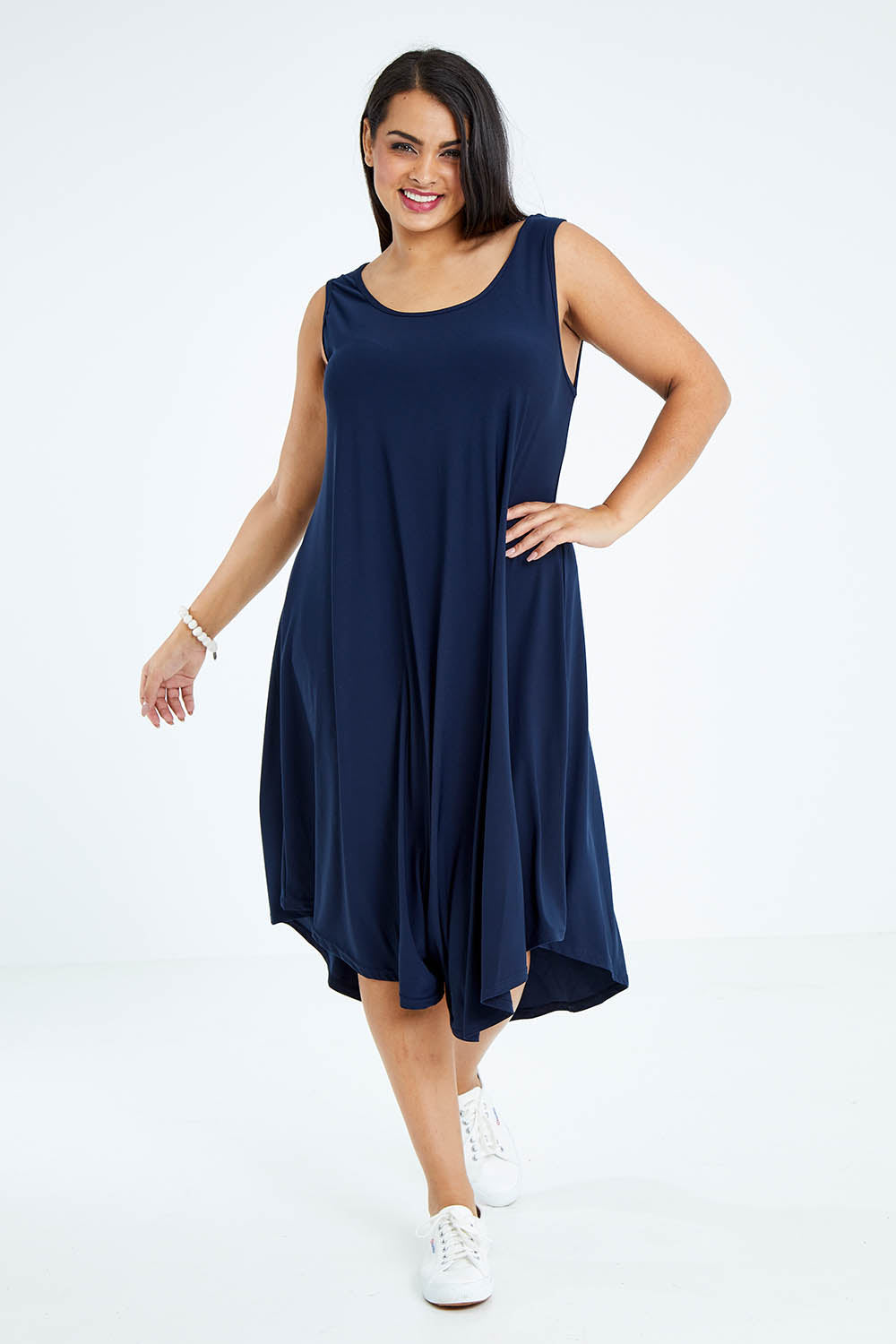 Model Sasha-Lee wearing size 16 of The Recycled High Low Dress in colour Navy (Blue), from the front, showing the whole outfit