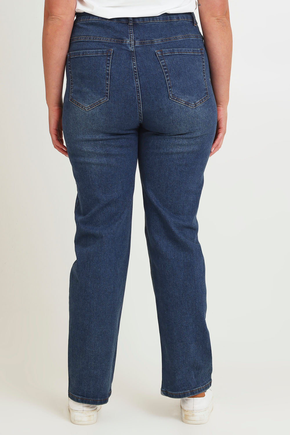 Model Chanel wearing size 16 of The Keepers Highwaisted Straight Jean in colour Darkdenim (Blue), from the back