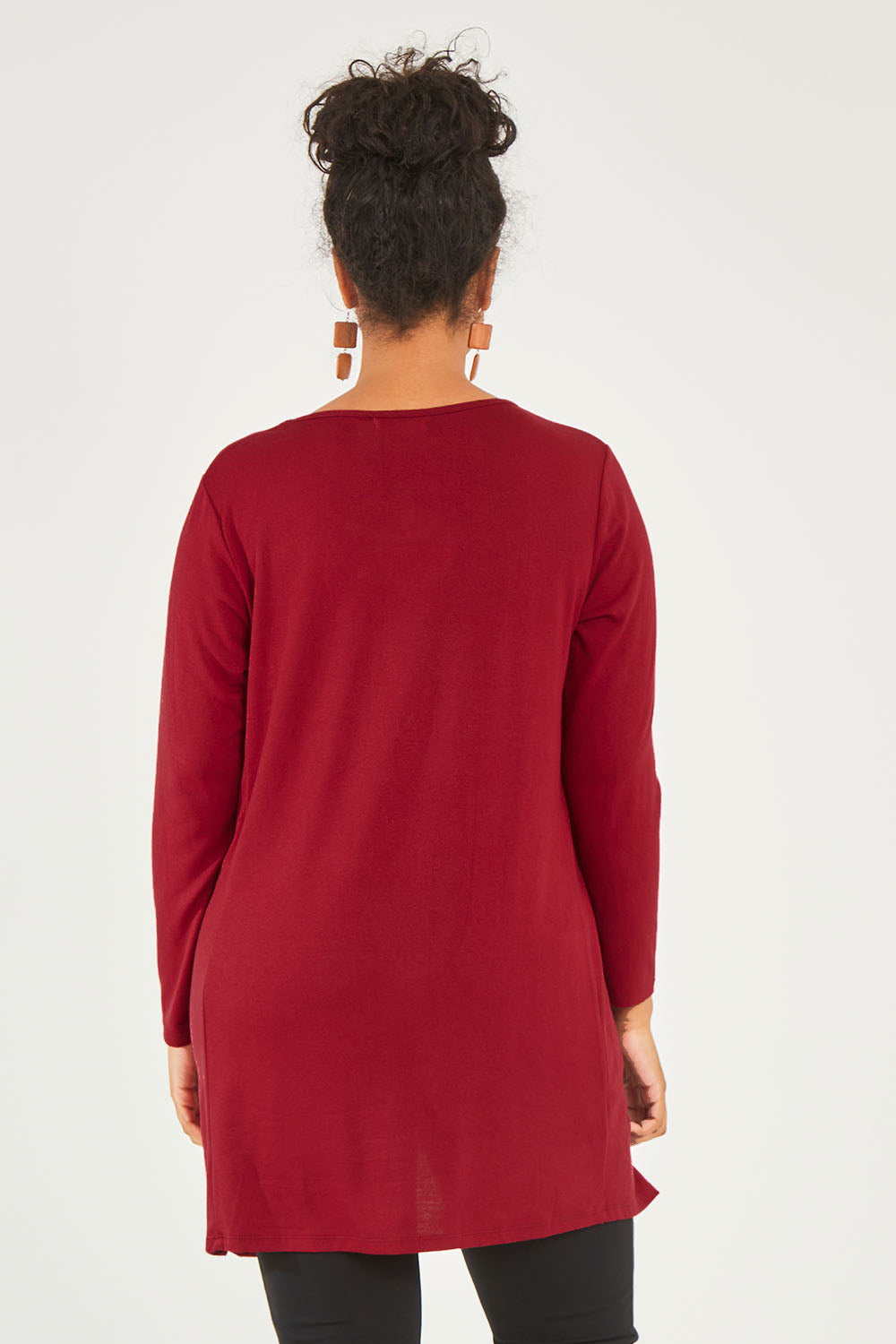 Model Noli wearing size 14 of The Crew Neck High Low Tunic in colour Redberry (Red), from the back