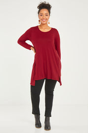 Model Noli wearing size 14 of The Crew Neck High Low Tunic in colour Redberry (Red), from the front, showing the whole outfit