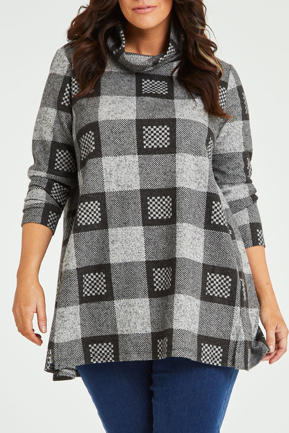 Model Laura wearing size 14 of The Woolly Knit High Low Tunic in colour Blackgrey (Black), from the front, cropped image