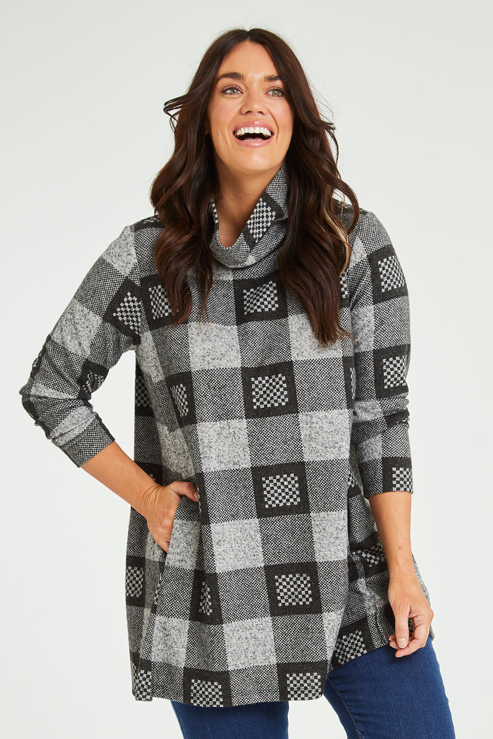 Model Laura wearing size 14 of The Woolly Knit High Low Tunic in colour Blackgrey (Black), from the front, cropped image