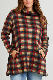 Model Laura wearing size 14 of The Woolly Knit High Low Tunic in colour Navycheck (Blue), from the front, cropped image