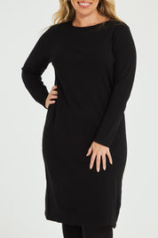 Model Katie wearing size XL of The Everyday Knit Midi Dress in colour Black (Black), from the front, cropped image
