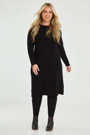 Model Katie wearing size XL of The Everyday Knit Midi Dress in colour Black (Black), from the front, showing the whole outfit