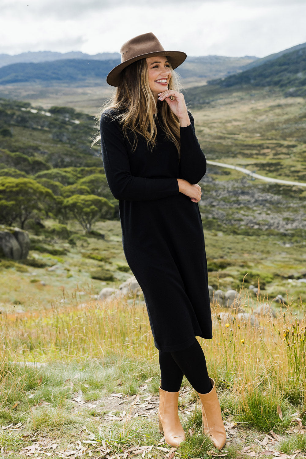 Model Tahlia wearing size S of The Everyday Knit Midi Dress in colour Black (Black), from the front, showing the whole outfit