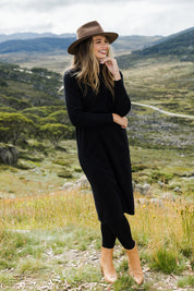 Model Tahlia wearing size S of The Everyday Knit Midi Dress in colour Black (Black), from the front, showing the whole outfit