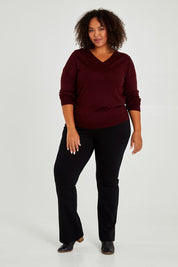 Model Alexis wearing size 18 of The Pull On Ponte Boot Leg Pant in colour Black (Black), from the front, showing the whole outfit