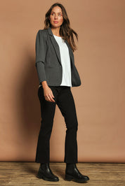 Model Madeline wearing size 10 of The Pull On Ponte Boot Leg Pant in colour Black (Black), from the front, showing the whole outfit