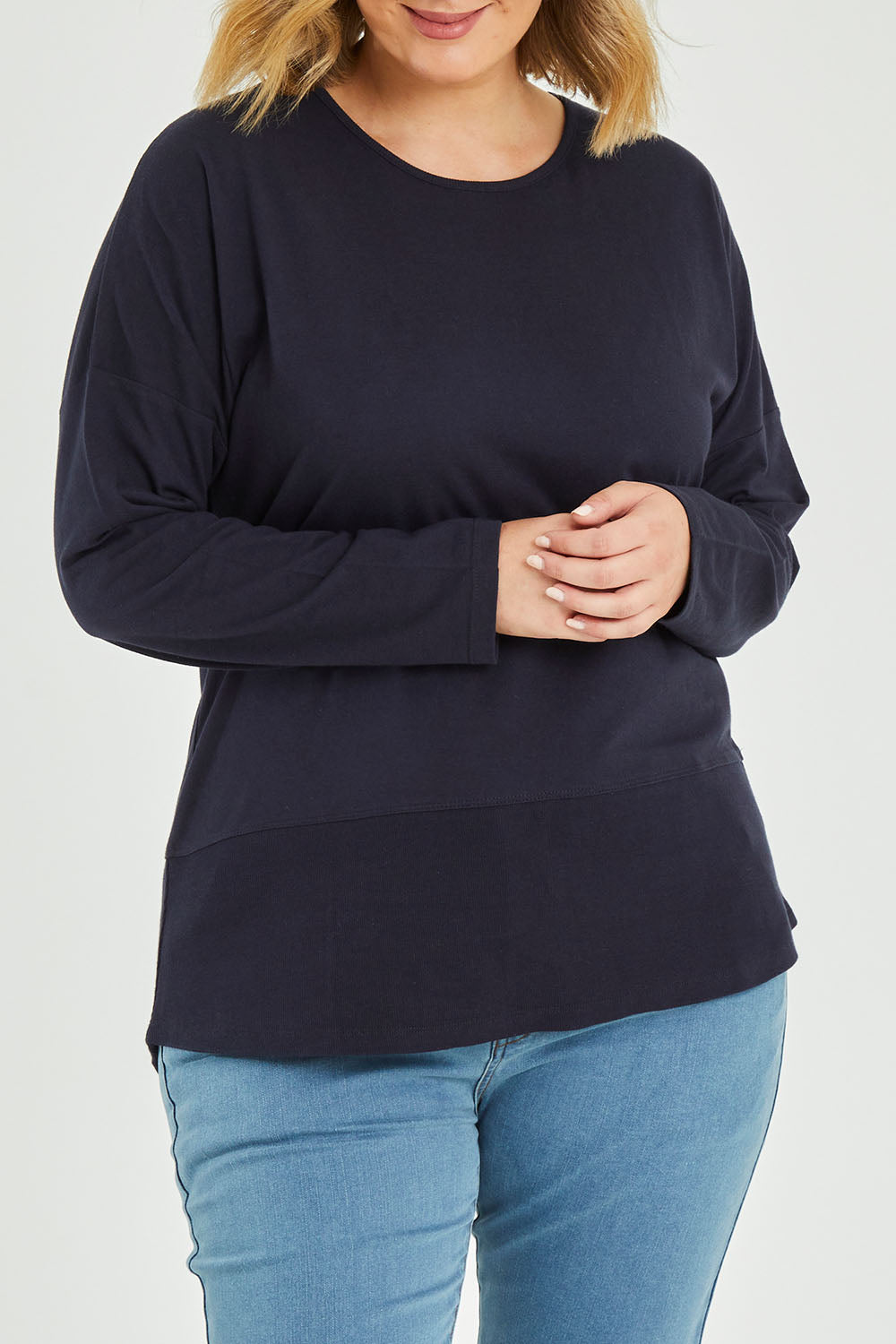 Model Jess wearing size 14 of The Rib Trim Long Sleeve Tee in colour Navy (Blue), from the front, cropped image