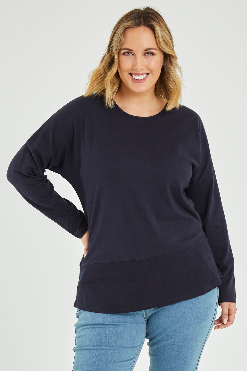 Model Jess wearing size 14 of The Rib Trim Long Sleeve Tee in colour Navy (Blue), from the front, cropped image