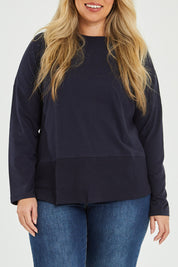 Model Katie wearing size 16 of The Rib Trim Long Sleeve Tee in colour Navy (Blue), from the front, cropped image