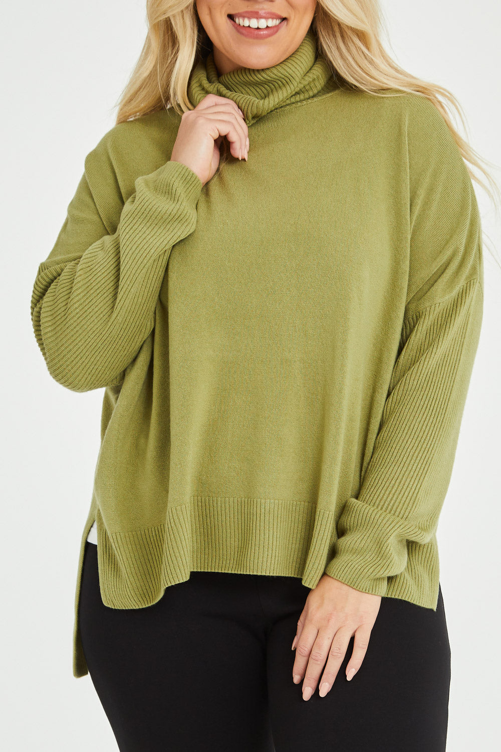 Model Katie wearing size XL of The Essential Soft High Low Jumper in colour Avocado (Green), from the front, cropped image