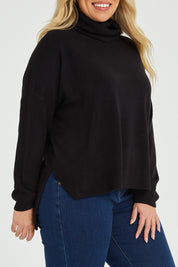 Model Katie wearing size XL of The Essential Soft High Low Jumper in colour Black (Black), from the front, cropped image
