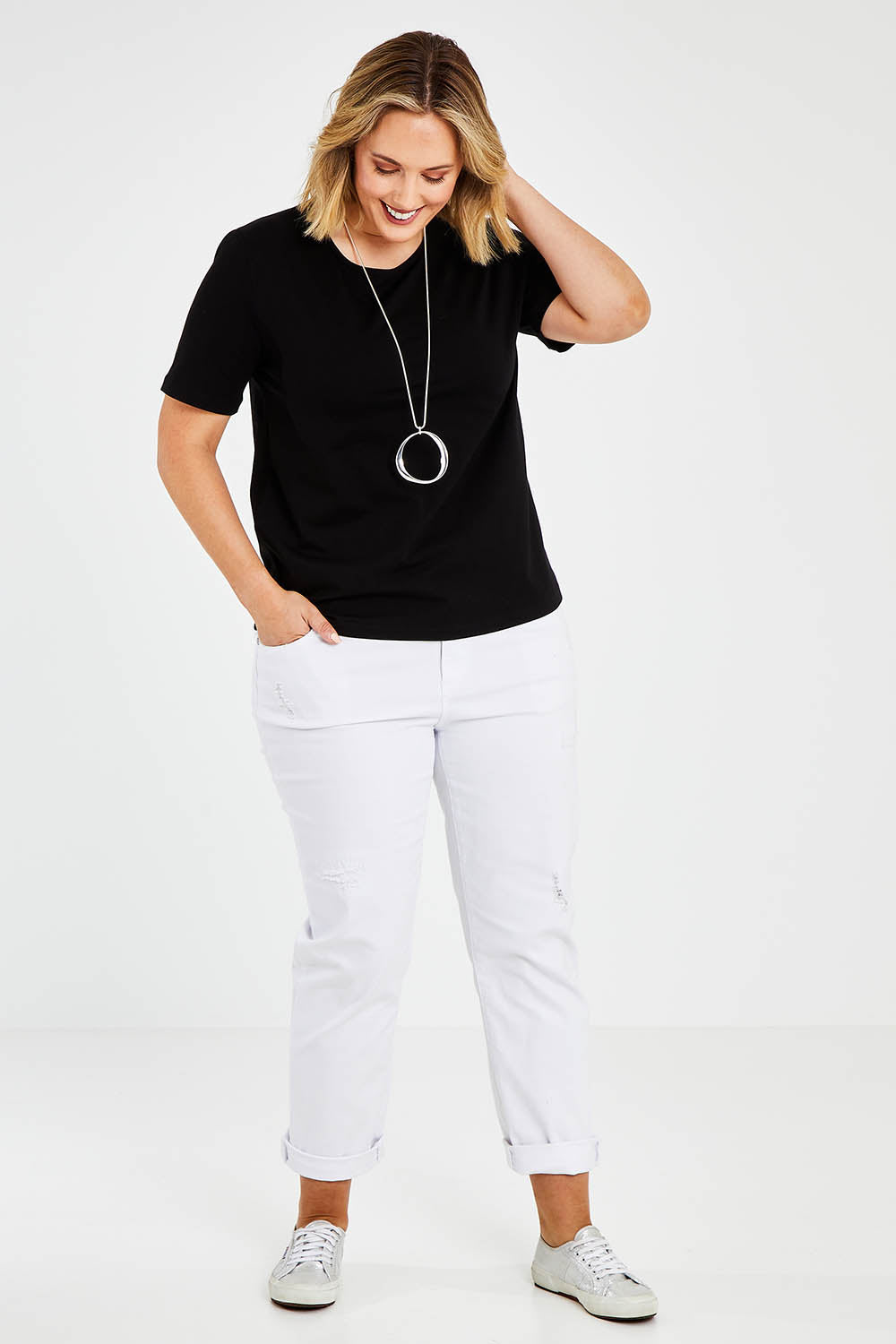 Model Jess wearing size 14 of The Keepers Tee in colour Black (Black), from the front, showing the whole outfit