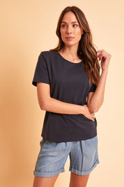 Model Madeline wearing size 10 of The Keepers Tee in colour Darknavy (Blue), from the front, showing the whole outfit